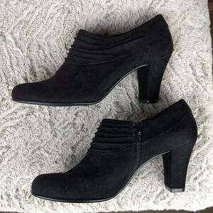 Black suede ankle booties with tapered heel